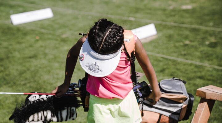 Canva Girl Holding Golf Bag 1 scaled 1